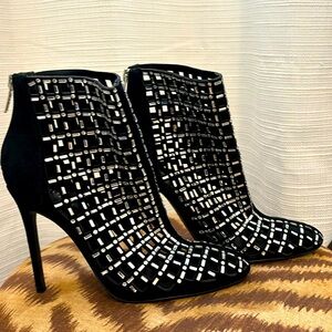 Black suede heeled booties with faux diamonds by Guess